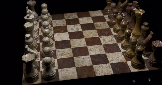Chess board with wooden pieces ready for play