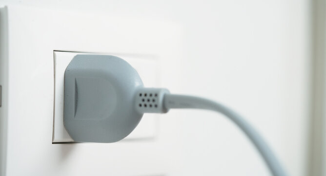 Electrical plugs with circuit breakers and fire-resistant materials for safety