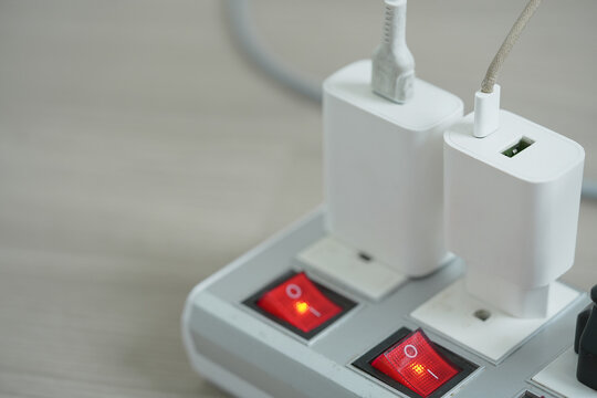 Electrical plugs with circuit breakers and fire-resistant materials for safety
