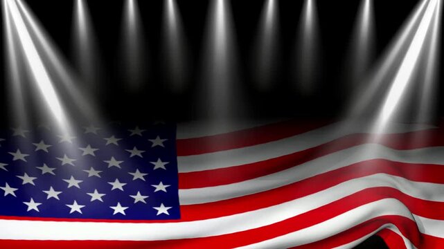 American flag waves proudly under bright dramatic stage spotlights that highlight the fabric texture and patriotic colors in a formal setting designed for national ceremonies or political events.