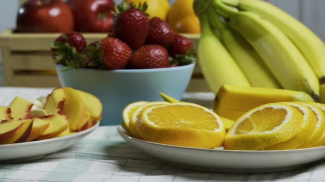 Kitchen counter filled with fruit - closeup tracking shot
