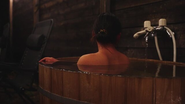 Japanese Woman Bathing in Private Onsen Bathtub at Night