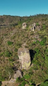 Vertical aerial pullback of El Nido del Zopilote and Piedrotas Los Compadres in Las Pe&ntilde;as Ecological Park, Ciudad Guzman, Mexico