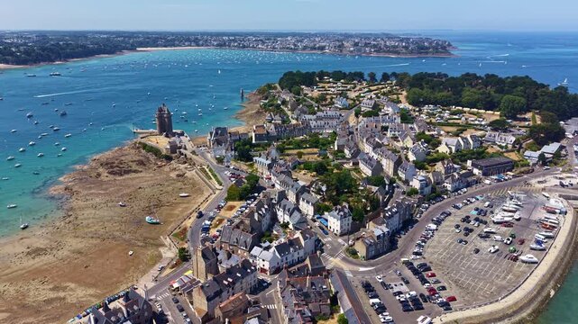 Drone pulling back from Solidor Tower overlooking the Aleth district and the Rance estuary in Saint-Malo, France