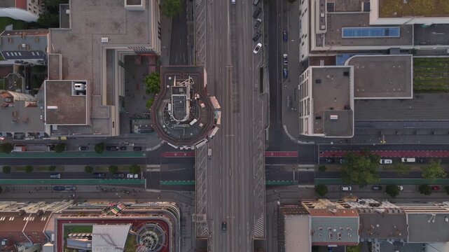 The iconic Bierpinsel tower structure standing out in the Steglitz district of Berlin during a warm sunset Fantastic aerial view drone camera pointing down