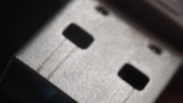 Macro close up of USB port connector highlighting metal contacts and electronic interface. Detailed view of computer hardware component used for data transfer and connectivity