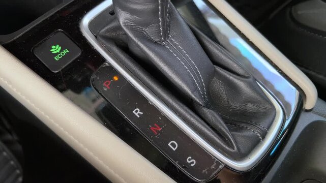 Automatic gear shift selector lever transmission knob handle shifted from parking to neutral and back