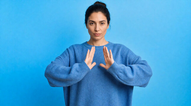 young woman showing stop sign