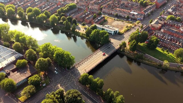 Wide overhead 4K 60FPS aerial GV video of Ormeau Bridge in South Belfast, Northern Ireland in the UK. Produced of a summer evening with Rec709 color.