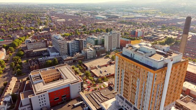 Reversing 4K 60FPS aerial GV video of Belfast City Hospital in Belfast, Northern Ireland in the UK. Produced of a summer evening in with Rec709 color.