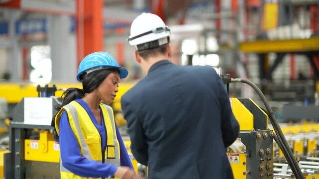 Factory engineer reviewing production document technician beside metal sheet machine, manufacturing operation, industrial inspection, engineering collaboration, production workflow, quality control.