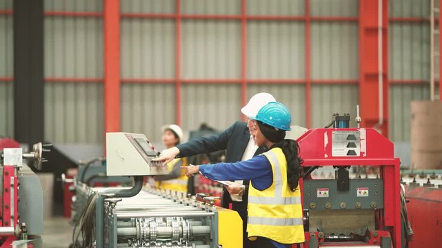 Industrial engineering team checking production equipment and reviewing process document, manufacturing workflow, quality assurance, factory management, engineering operation.
