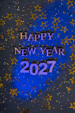Happy new year 2027 text with colorful decorations and cheerful theme