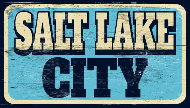 Aged and worn vintage Salt Lake City sign on wood