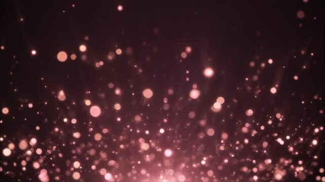 Soft glowing rose gold bokeh particles drift upward against deep charcoal background, shimmering with warm metallic glow and dreamy cinematic atmosphere in elegant slow motion.