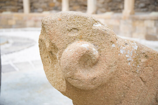 Ancient ram stone statue tombstone close up in Old City of Baku Azerbaijan with copy space