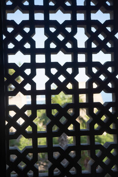 Geometric shebeke stone carved window screen silhouette in Palace of Shirvanshahs Baku with copy space