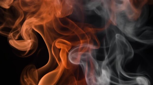 Burnt rust orange and charcoal grey smoke drifts upward in slow motion, intertwining into soft wisps under dramatic backlighting with cinematic atmospheric depth against a dark background.