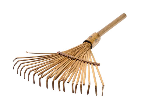 Bamboo garden rake with wooden handle isolated on a solid black background