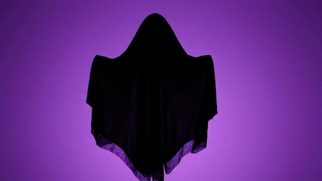 Halloween ghost silhouette cloak hood sheet fabric on purple background spooky minimal mood dark night mystery art