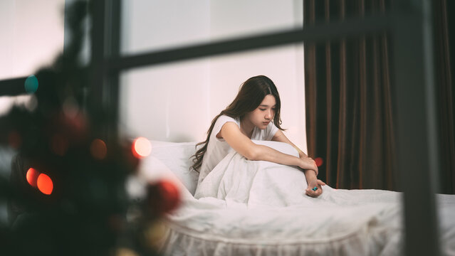 Young adult lonely sadness woman take medicine for mental health therapy for holidays depression