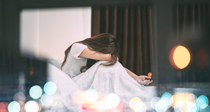 Young adult lonely sadness woman take medicine for mental health therapy for holidays depression