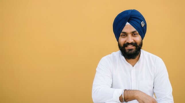 Sikh man wearing a traditional blue turban smiling