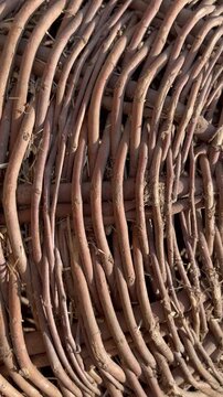 Macro texture of a handmade brown wicker basket background
