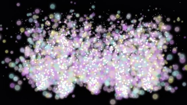 Vibrant purple and pink shimmering bokeh particles and glowing glitter on black background