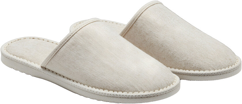 Pair of soft canvas slippers on solid background