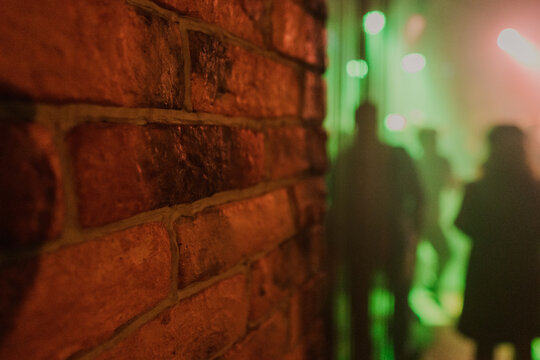 A wall illuminated by spotlights in a nightclub