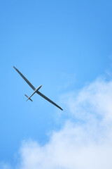 Fototapeta premium Sleek aircraft gliding through calm summer weather