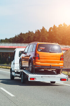 Emergency vehicle hauling broken car safely