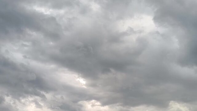 Dark dramatic overcast sky with heavy stormy grey clouds moving before rain. Bad weather and storm warning background