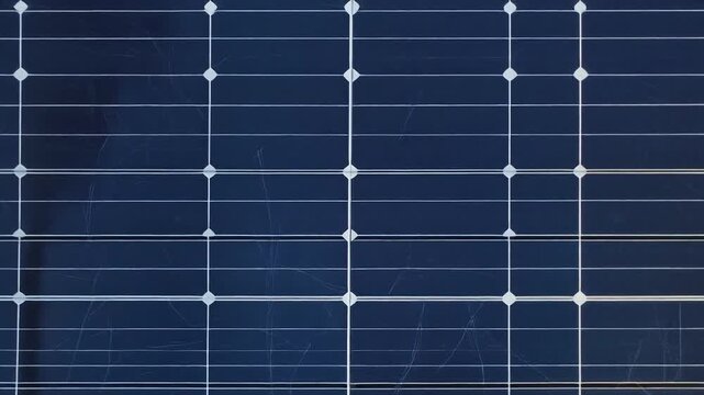Modern blue solar panel grid surface for corporate ESG reports, renewable energy websites, and clean tech presentations. High-end commercial background footage.