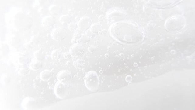 Cosmetics serum gel background, cream, shampoo, macro soap bubbles, foam texture