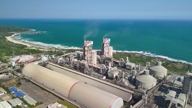 Aerial shot of cement storage and processing units, symbolizing production, engineering, and modern development.