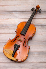 Musical instrument violin on wooden boards © i_valentin
