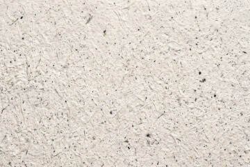 Fototapeta premium Light gray textured speckled paper background with background speckled recycled material stationary backdrop creative document minimalist abstract wallpaper template