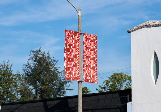 Mockup Of Two Customizable Vertical Street Banners On Light Pole