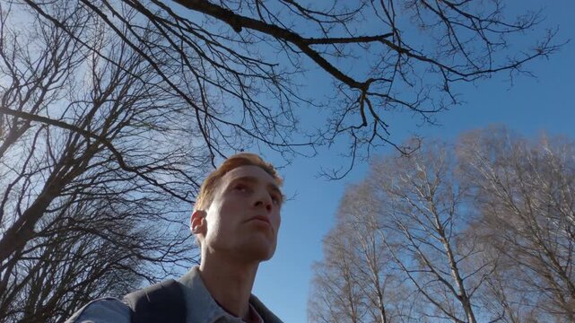 Young man sightseeing in the scenic Frognerparken in Oslo, Norway