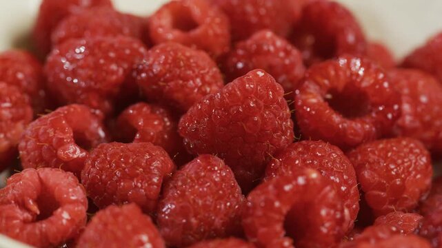 Extra closeup on delicious raspberries in cluster