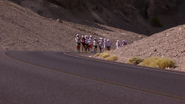 Badwater marathon athletes rounding a corner in death valley