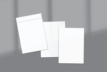 Fototapeta premium Minimal stationery mockup featuring blank cards and an envelope on a modern gray background. Perfect for branding presentations, business identity, invitations, greeting cards, corporate stationery