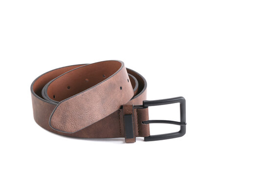 Coiled brown leather belt with black matte buckle laid out neatly on white background.