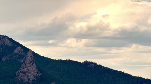 Scenic mountain landscape in Burabay National Park, Kazakhstan, beneath dramatic storm clouds before rainfall. Natural mountain peaks, changing weather, moody sky, peaceful wilderness and one of the c