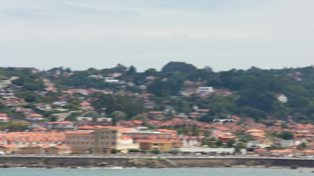 Military attack aircraft flies low over the water at high speed near Gijon, Spain