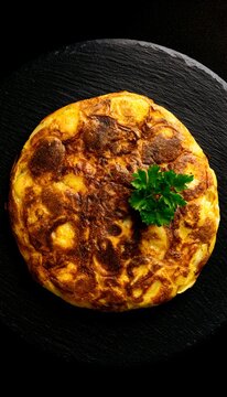 Golden potato tortilla artfully presented a rustic Spanish culinary delight evokes warmth and simple indulgence
