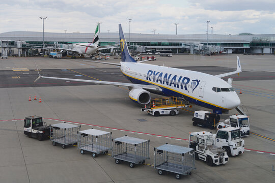 Prague, Czech Republic - July 21, 2026: Ryanair passenger airplane parked on the apron at Vaclav Havel Airport Prague (PRG) surrounded by ground support equipment and baggage carts during turn-around 