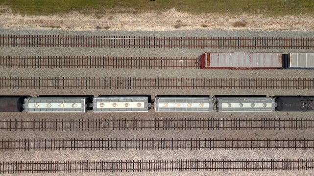 Aerial view of freight train cars on parallel tracks at the Georgia-Pacific Palatka Operations facility in Palatka, Florida, United States.